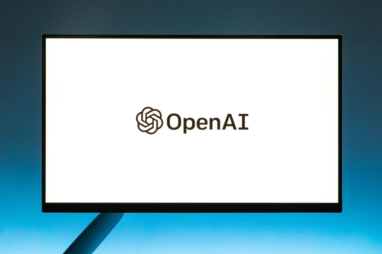 a computer monitor with the open ai logo displayed