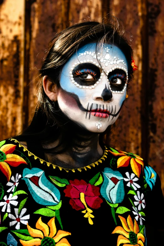 a woman with makeup artfully painted all over her face