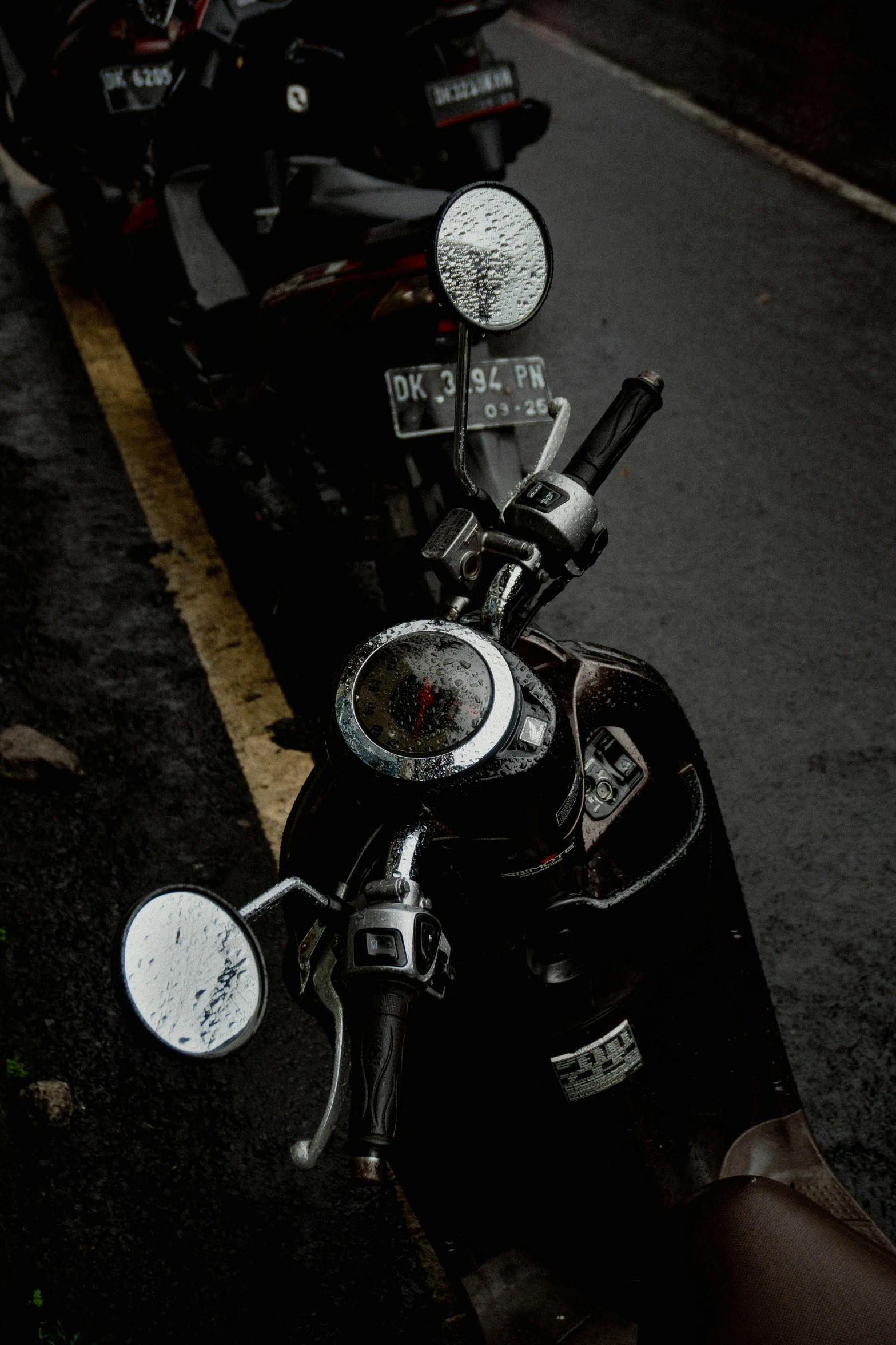 a motorcycle is parked on a narrow street