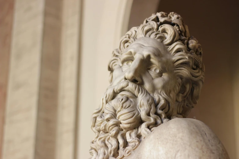 a stone bust of an old man with a beard