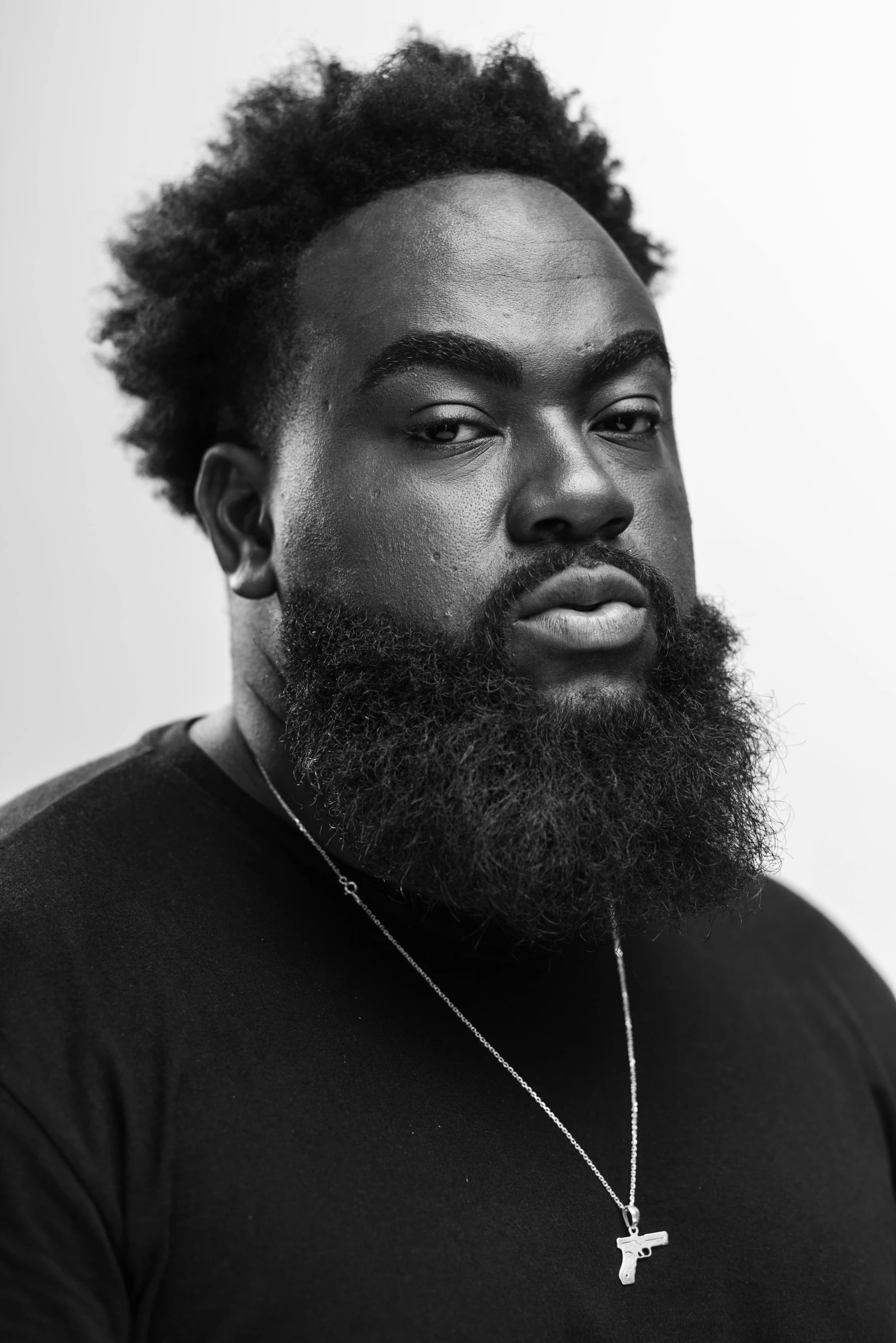 black and white image of a man with dreadlocks