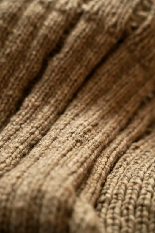 a brown sweater textured with an interesting pattern