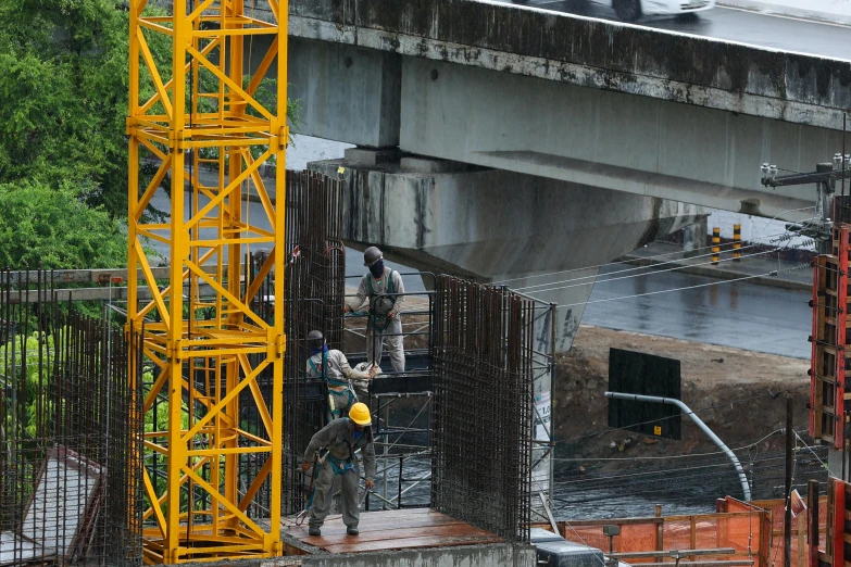 an area under construction where there is a big yellow crane