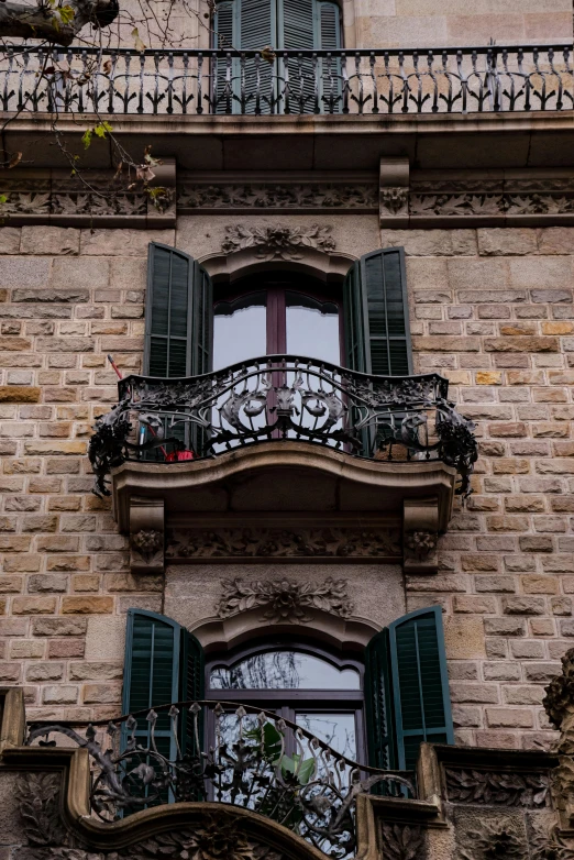 balcony with wrought iron railing and decorative wrought iron railings on an old building