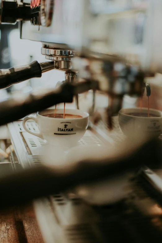 a cup of coffee being made at a coffee shop