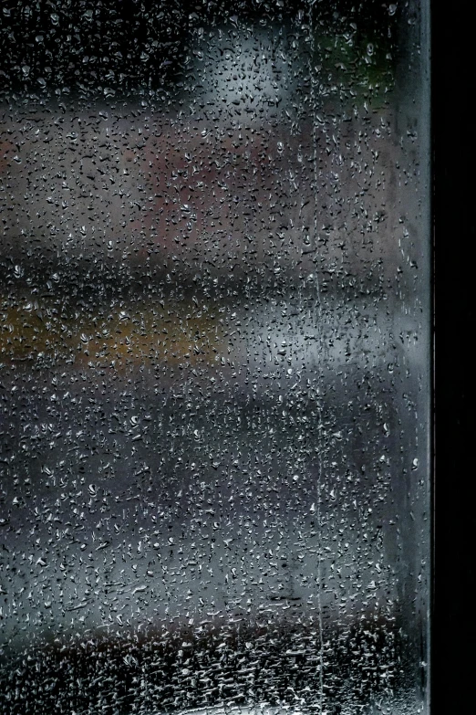 a window in the rain has water drops on it
