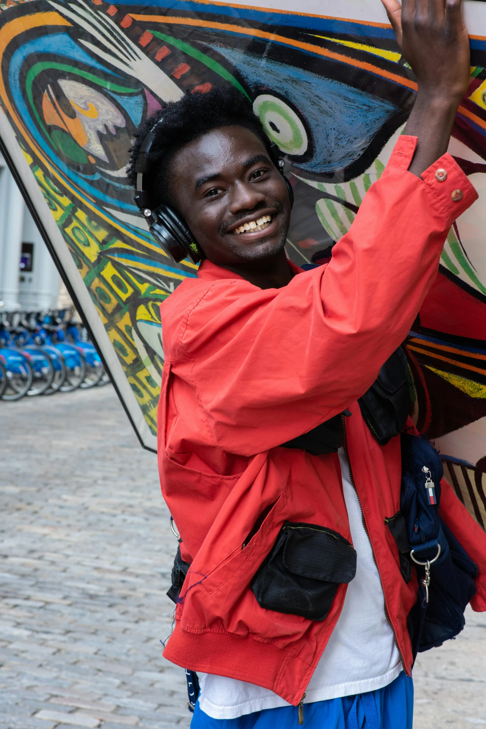 a man is smiling as he holds his board