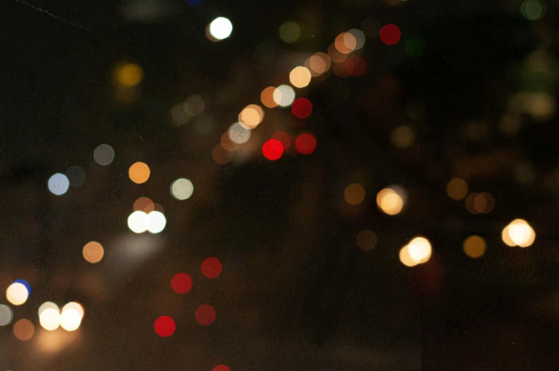 a blurry po of street lights and street signs