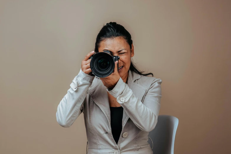 a woman is taking a po with her camera