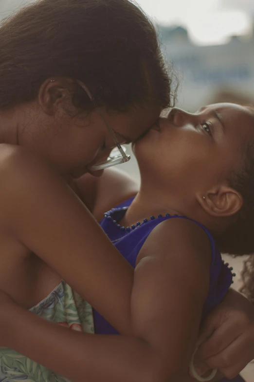 an image of two girls kissing each other