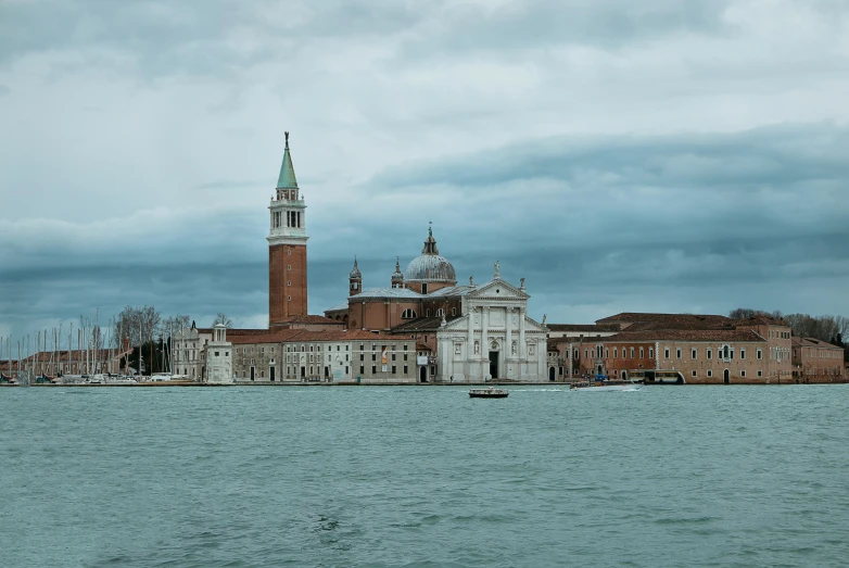 a river and a large building with an obelisk