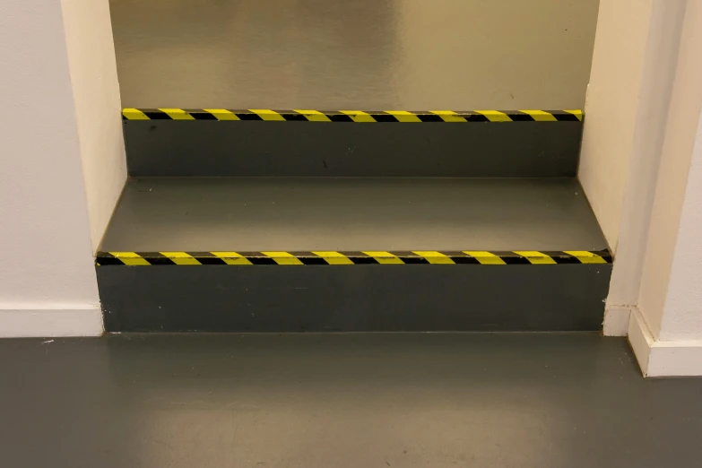 a set of stairs with a caution tape around them