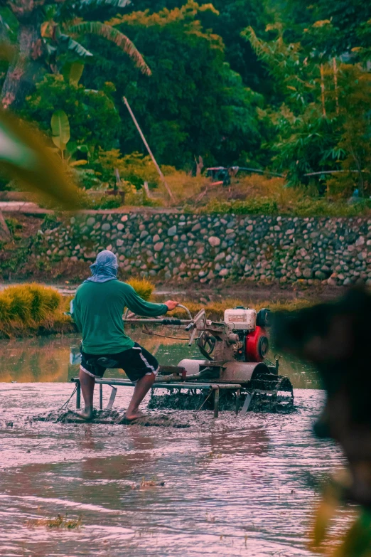 two men sitting at a small table in a stream