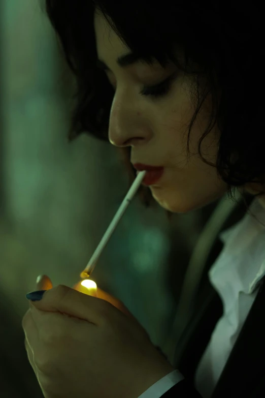 a woman smoking a cigarette while holding a lighter