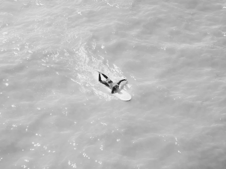 a man is on a surf board in the ocean