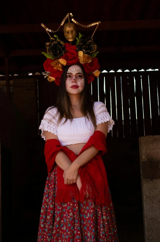 a woman with face paint is wearing a wreath on her head