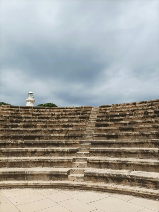 a big stone structure with steps and stairs next to it