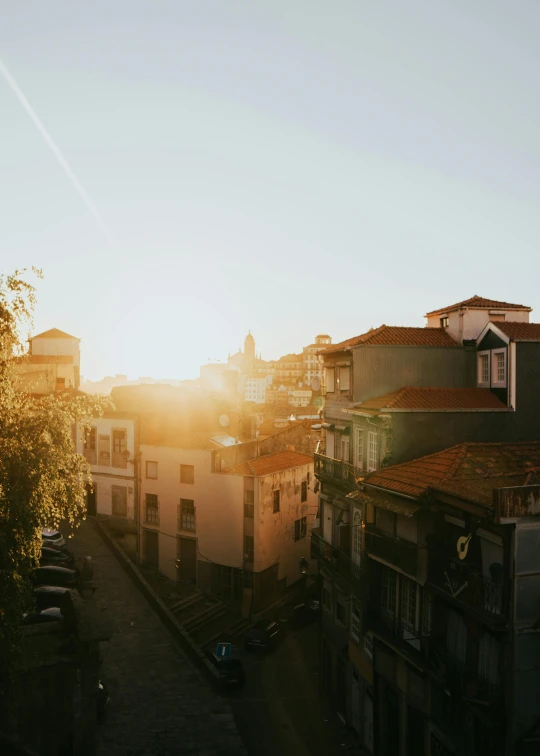 a view of a city at sunset or sunset from a balcony