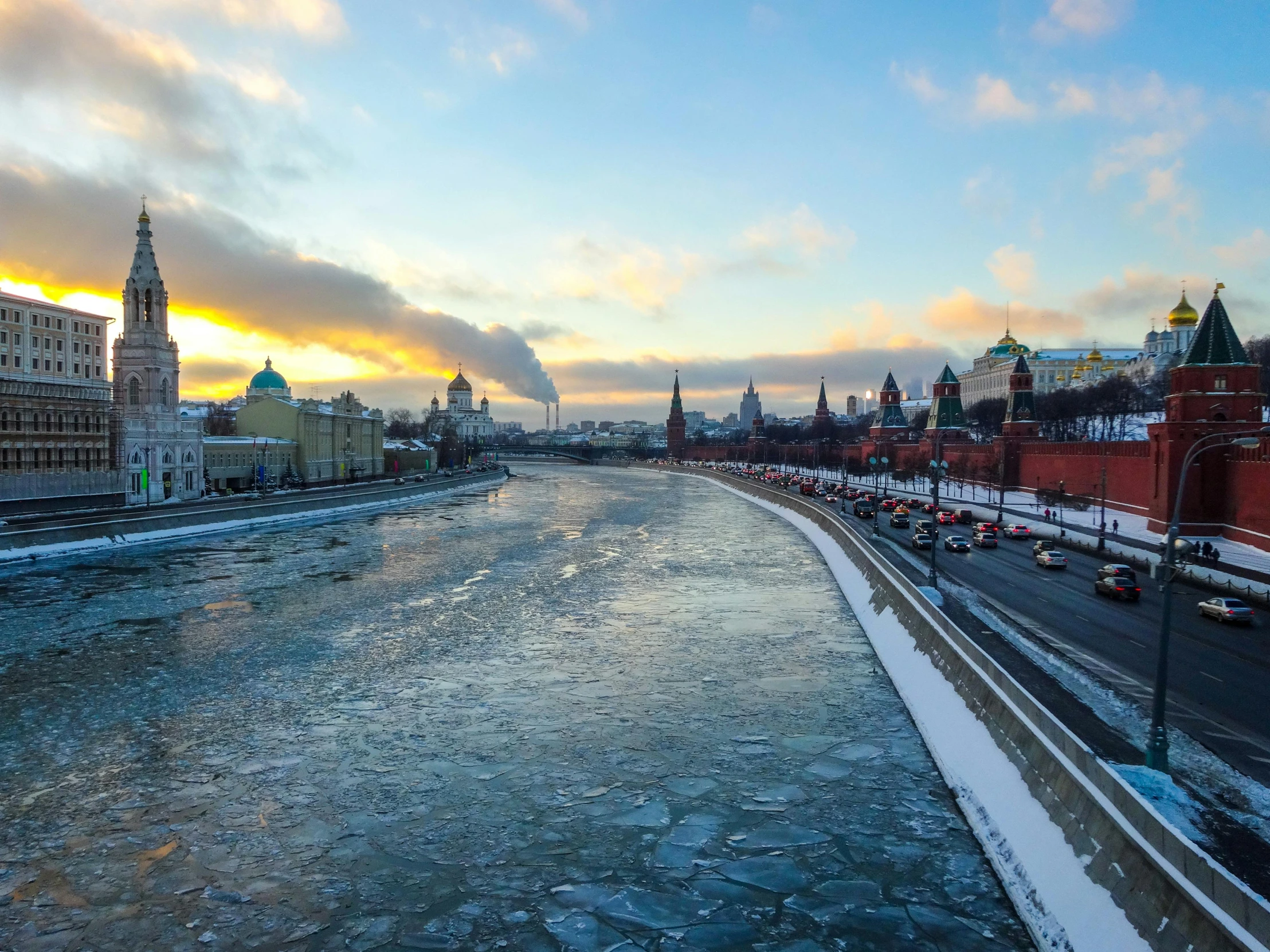 a view of the water and streets with snow and ice