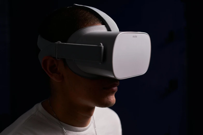 a man wearing a virtual glasses in the dark