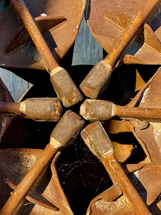 a closeup s of a metal object made from pieces of wood