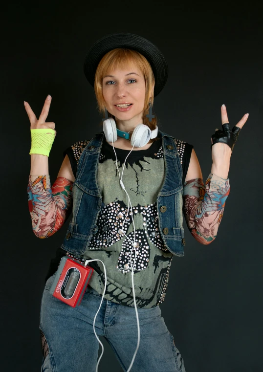 a woman with her hands up giving the peace sign