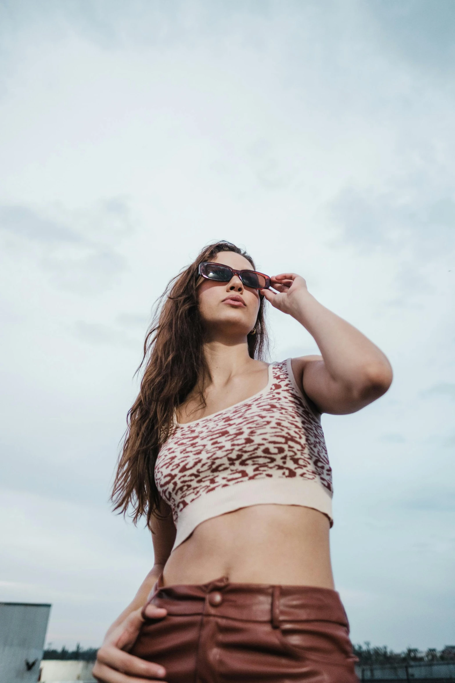 a woman standing outside with her head up