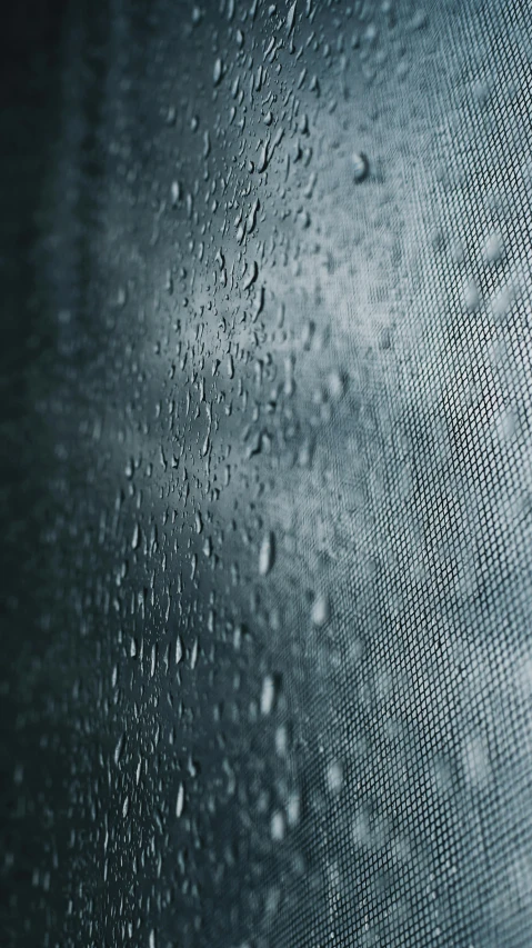 rain drops sitting on the side of a window