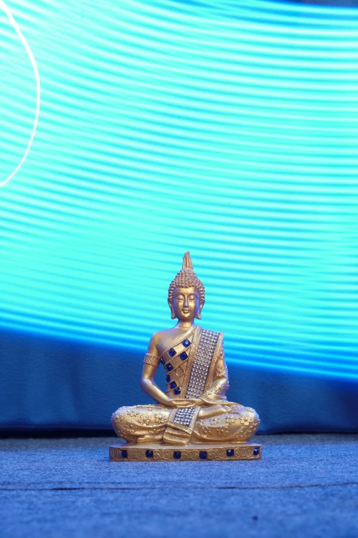 a small buddha statue sitting in a meditation position