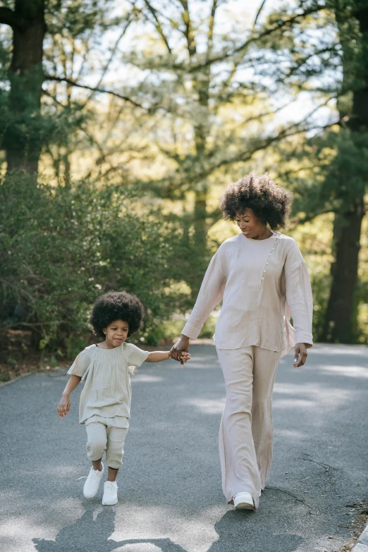 two children walking across the street holding hands