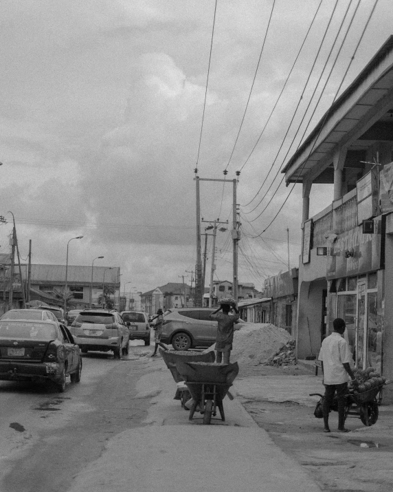 a black and white po of a street filled with cars