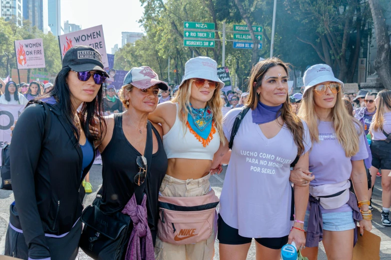 girls are posing on the street during an occupy rally