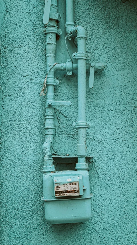 the front of a water pump mounted on to a wall