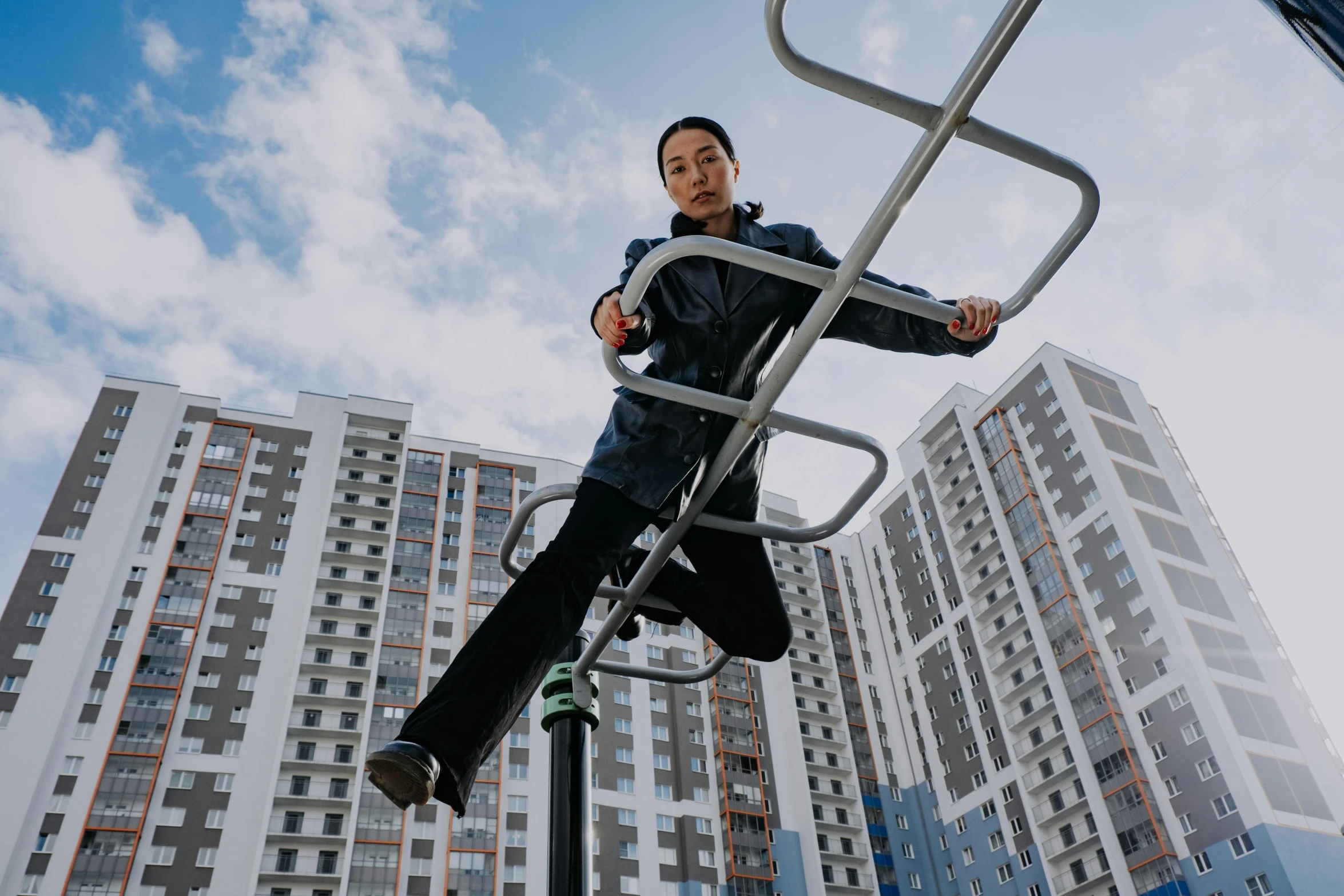 a man that is on top of a metal ladder