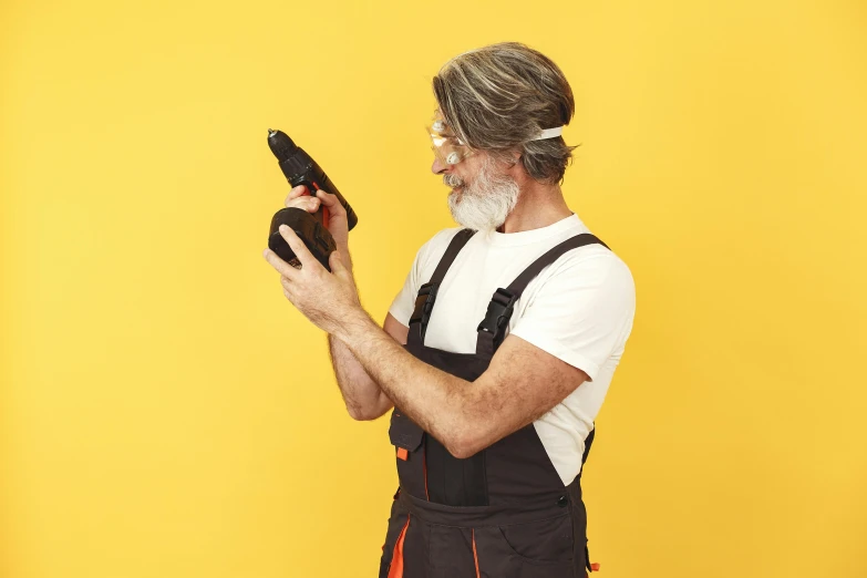 a man standing with a black ipad