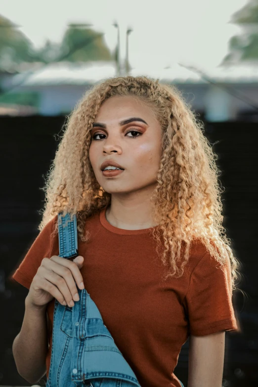 a beautiful young woman holding up a pair of scissors