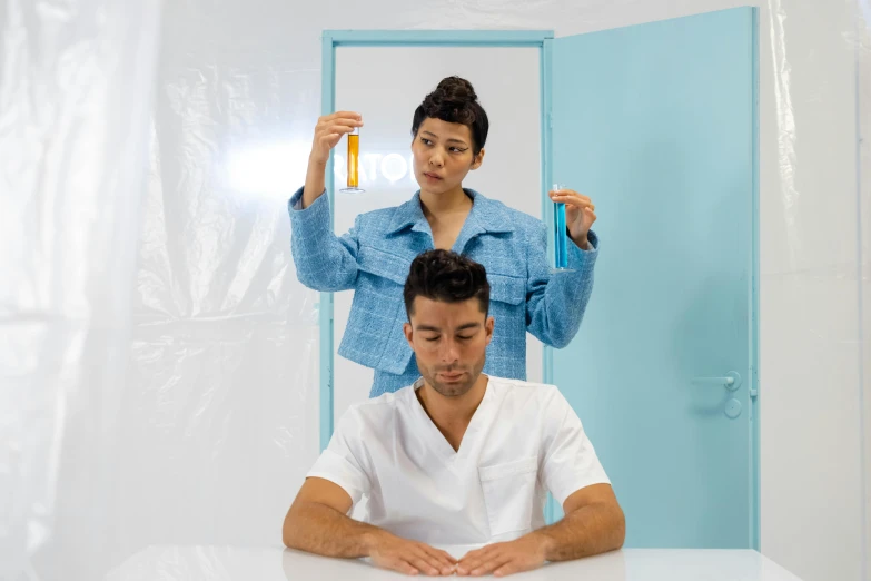 a man is using the hair brush as an alternative for a woman