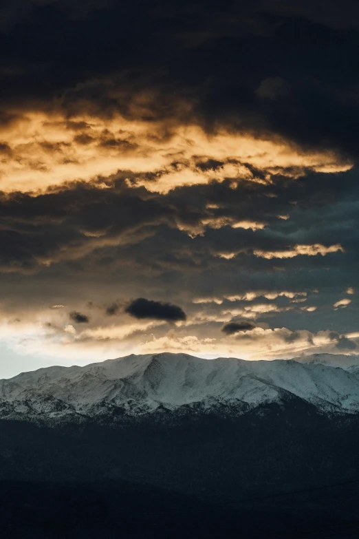 the sky is covered in a layer of clouds