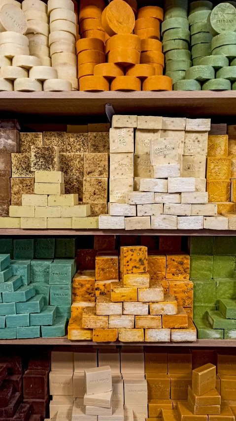 a shelf filled with different kinds of cakes and containers