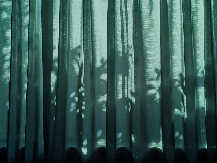 an image of some curtains with shadow and light