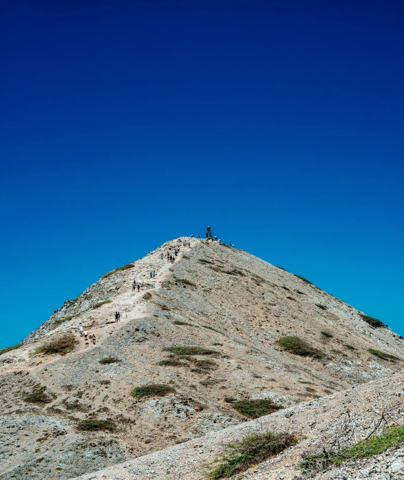 a person standing on top of a rocky hill