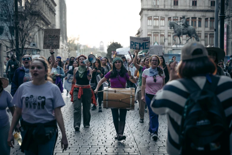 there are people marching down the street together