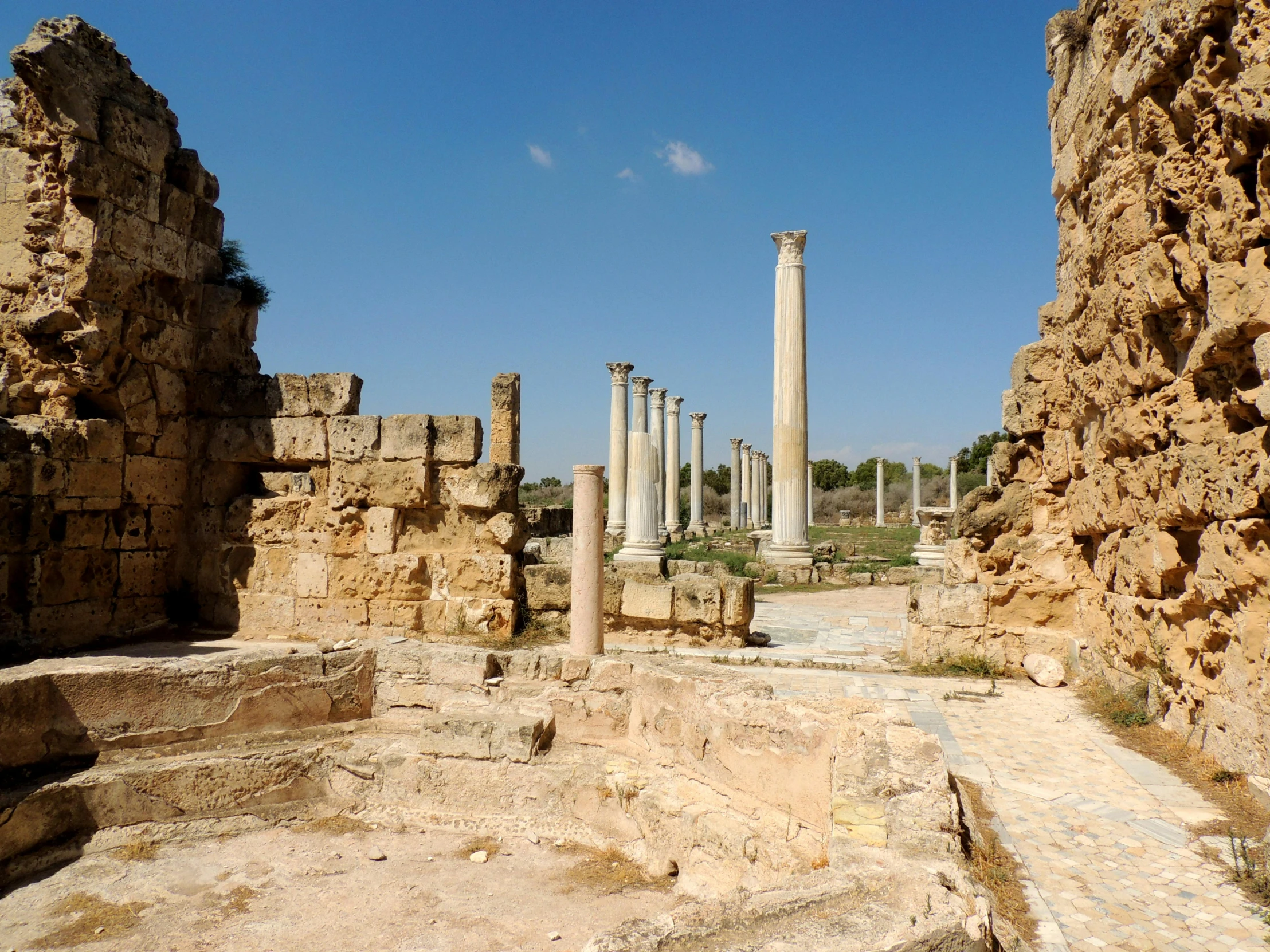 ruins on the side of the road with columns