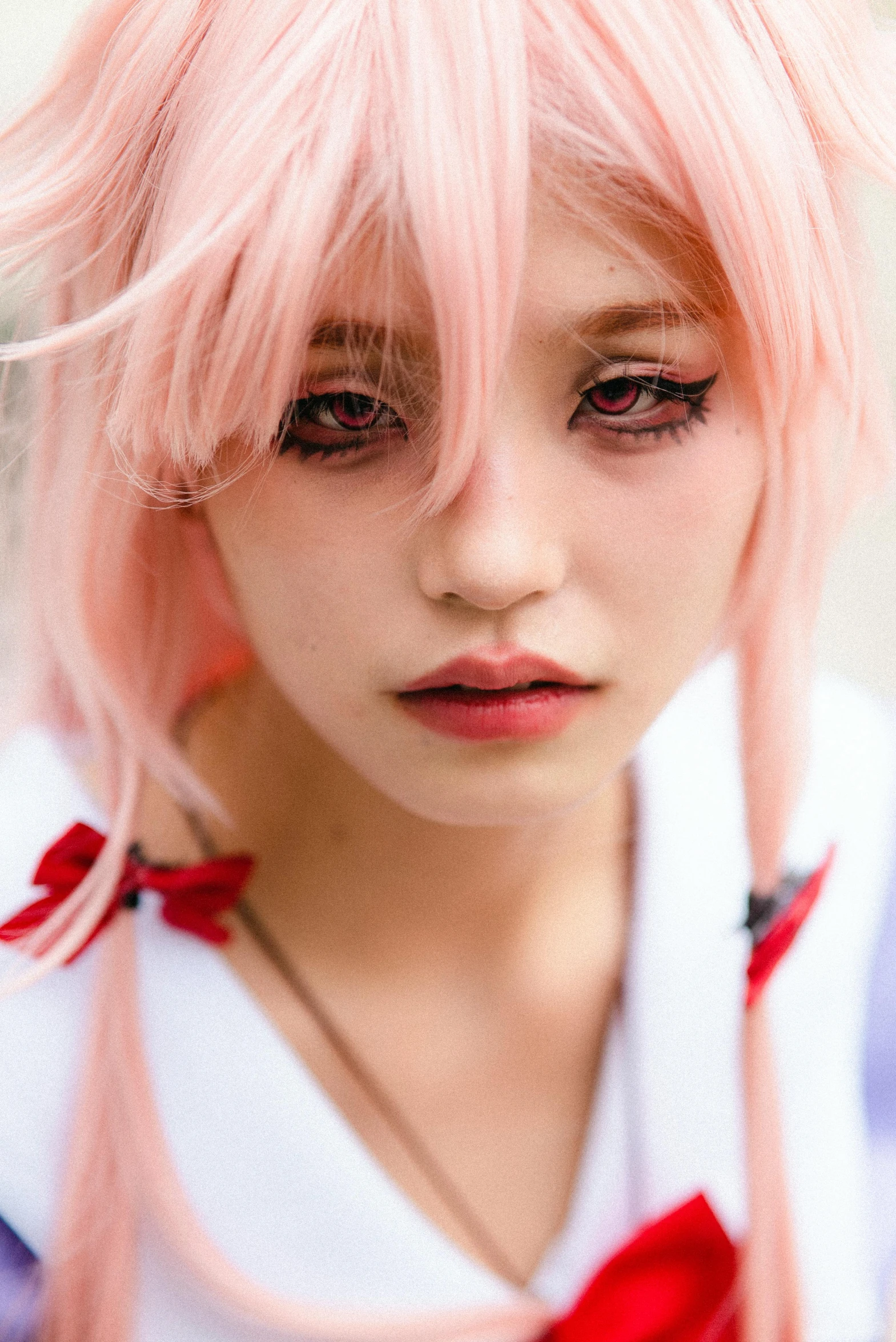 a girl with pink hair and a bow in her hair