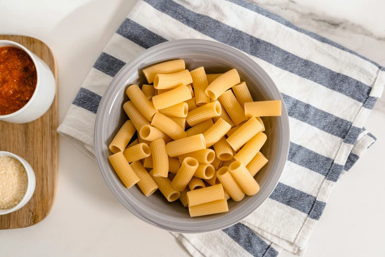 some pasta with sauce and garlic in a bowl