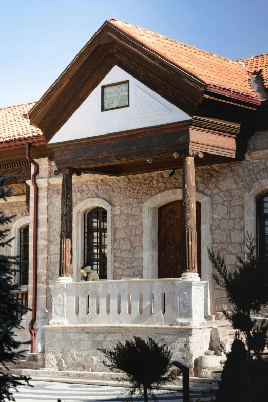 an old brick home with an open front porch