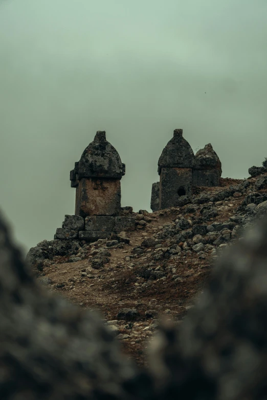 the rocky terrain has small building made of rocks