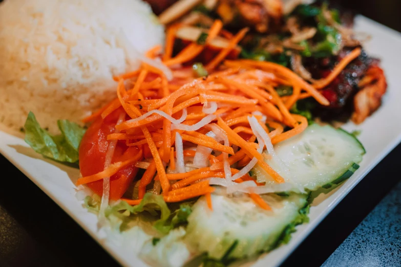 close up of some salad on a white plate