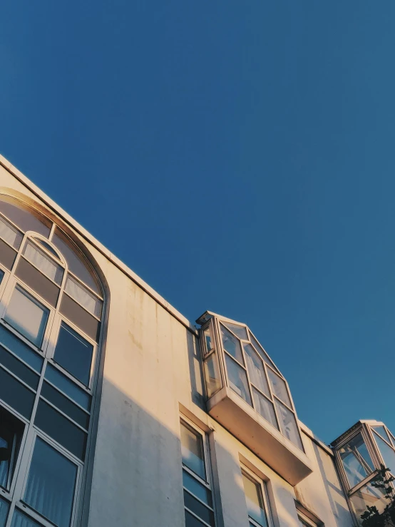 a tall white building with many windows