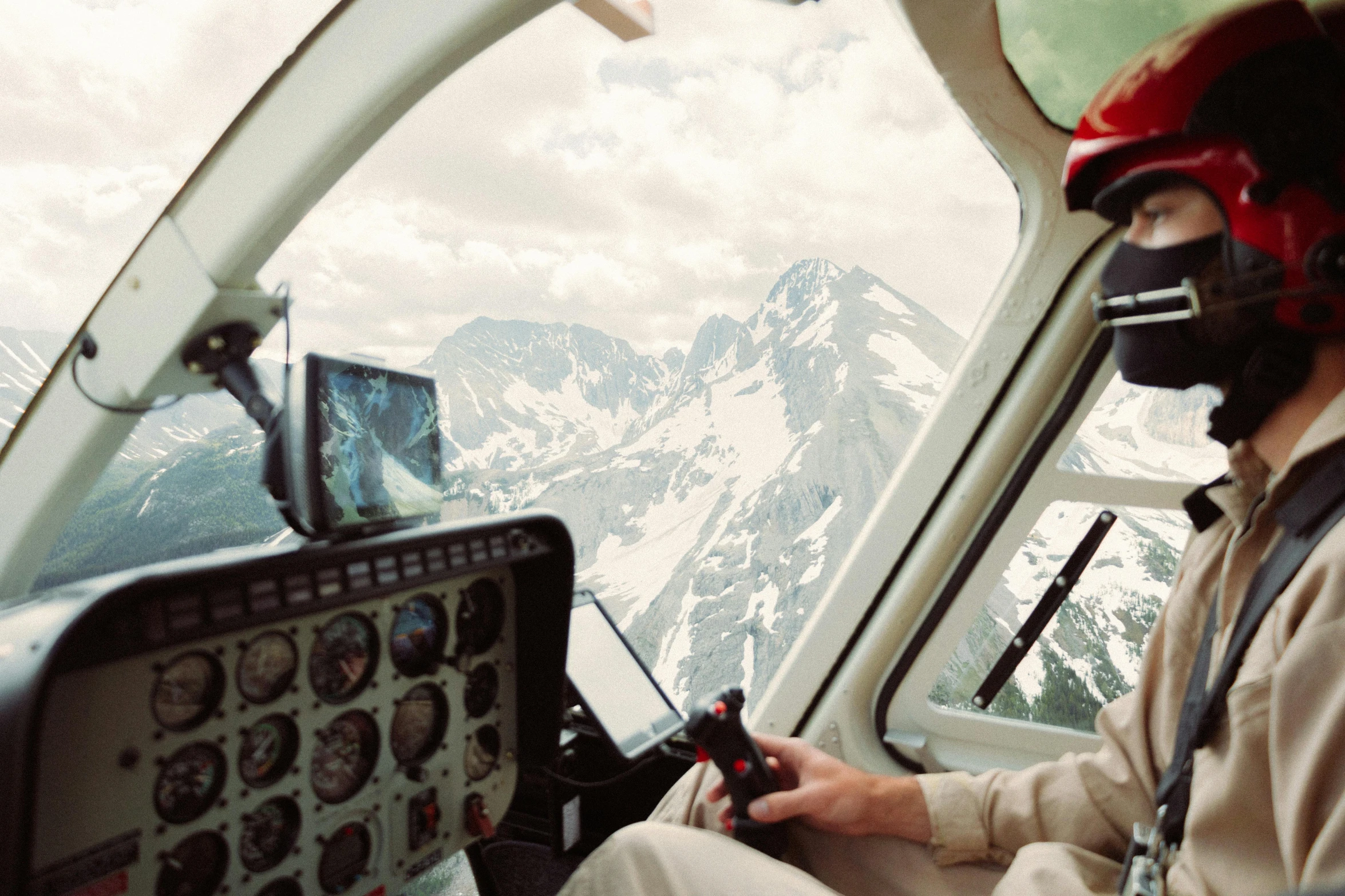 a pilot inside of a plane cockpit looking at the screen